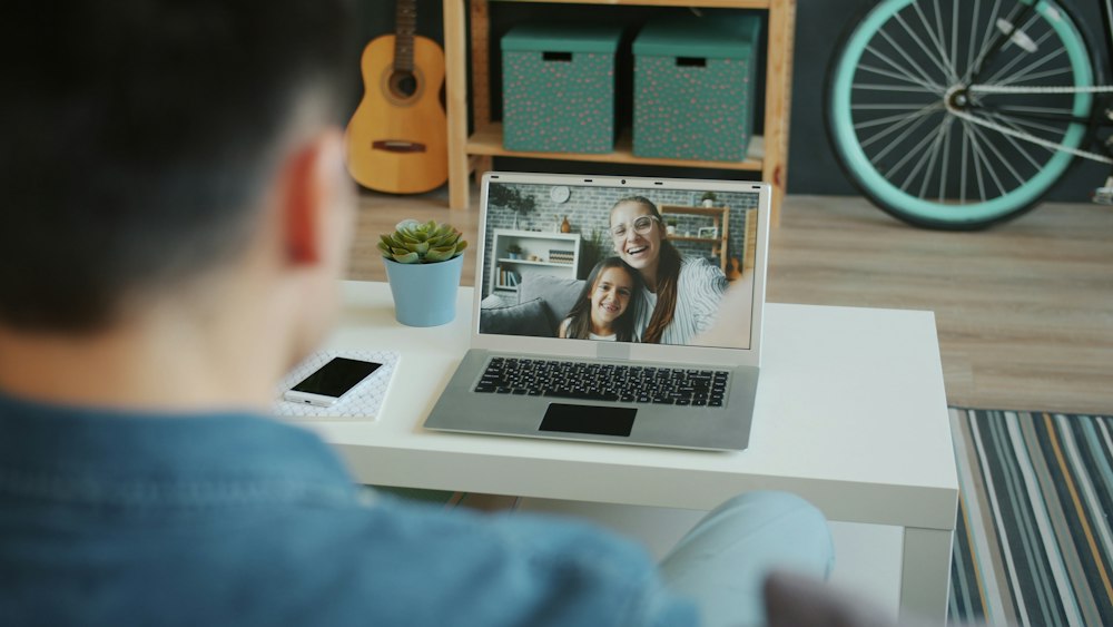 A family on a video check-in with a care manager